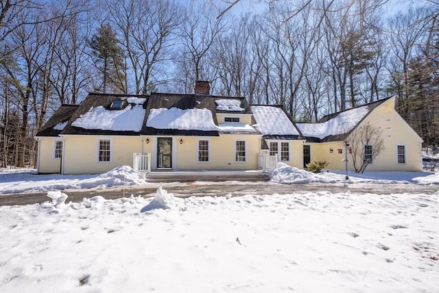 view of front of home with a chimney