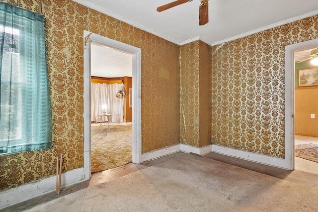 unfurnished room with a ceiling fan, wood finished floors, and crown molding