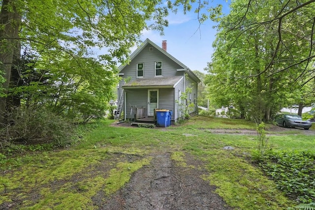 back of property featuring a chimney