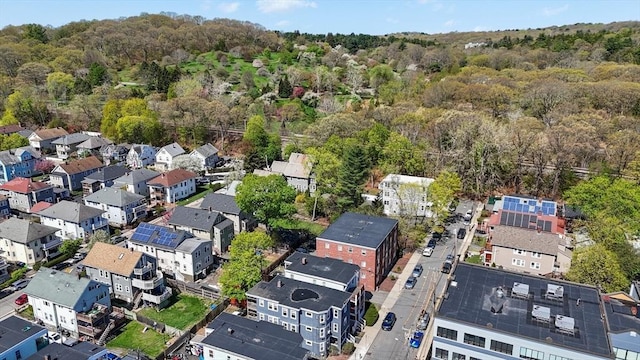 drone / aerial view featuring a forest view