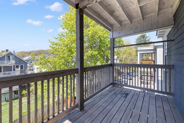wooden terrace with a residential view
