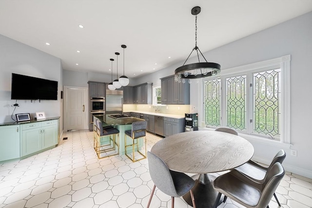 dining space with recessed lighting and baseboards