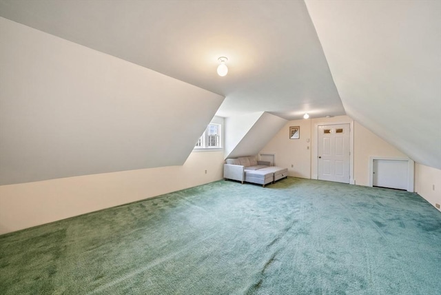 bonus room with carpet floors and lofted ceiling
