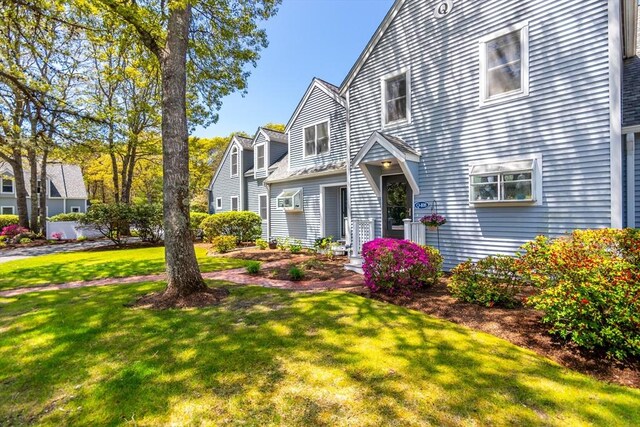 108 Shellback Way Unit 108Q, Mashpee, MA 02649 - view of property exterior with a lawn
