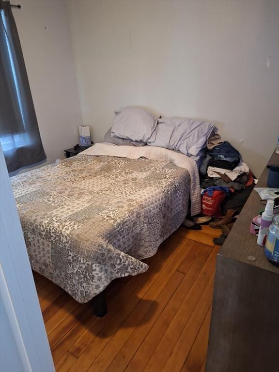 bedroom featuring wood-type flooring