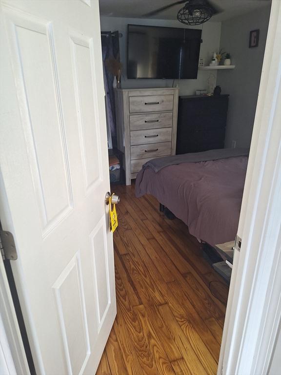 bedroom with hardwood / wood-style floors