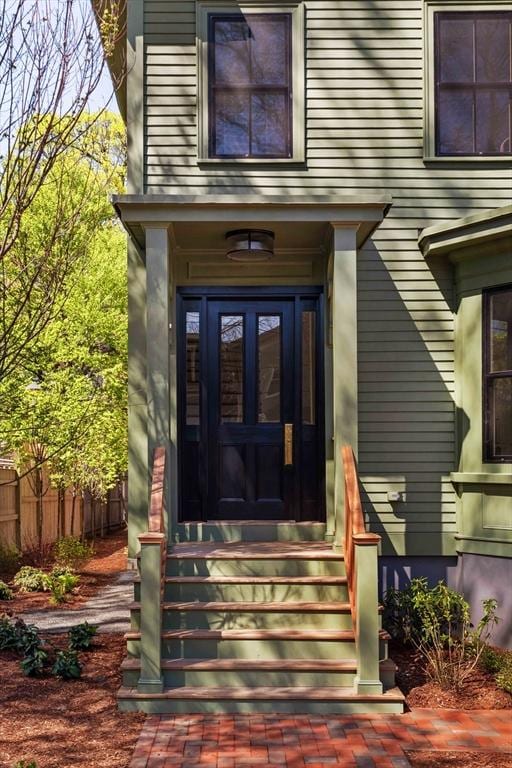 doorway to property with fence