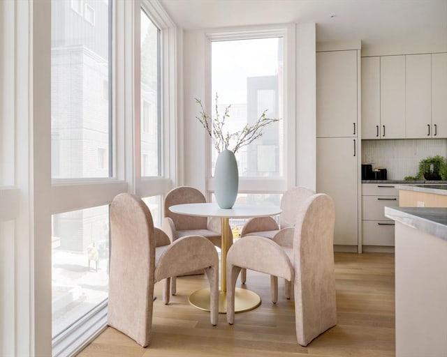 dining space featuring light wood-type flooring