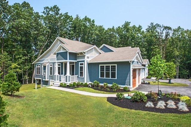 view of front of house with a front lawn and a garage