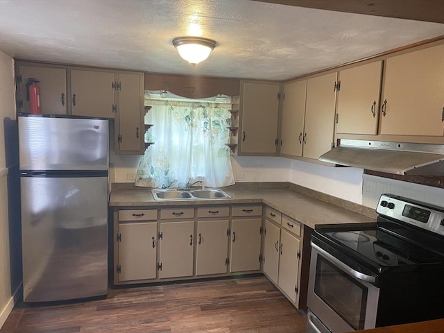 107 Rollins St, Springfield, MA 01109 - kitchen featuring stainless steel appliances, under cabinet range hood, and dark wood-style flooring