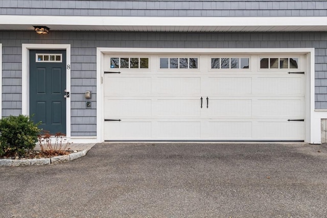 garage featuring driveway