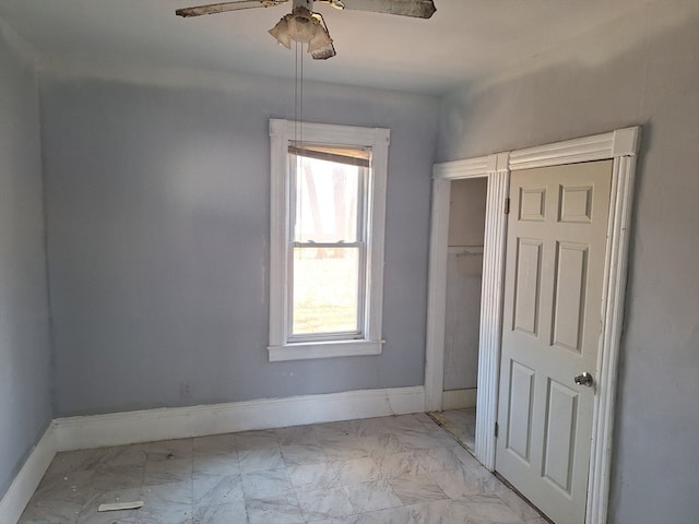 unfurnished room with ceiling fan