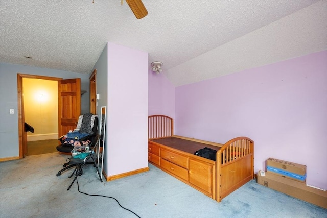 1-3 Fairoaks Ave, Methuen, MA 01844 - carpeted bedroom with lofted ceiling, a textured ceiling, baseboards, and a ceiling fan