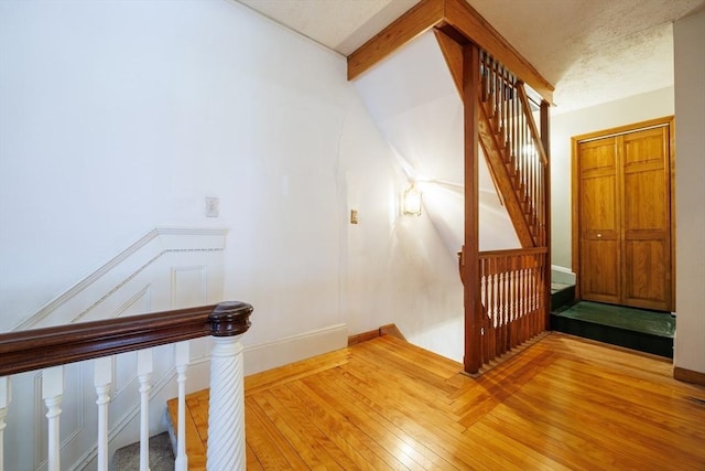 1-3 Fairoaks Ave, Methuen, MA 01844 - additional living space featuring light wood-style flooring, stairway, baseboards, and beamed ceiling