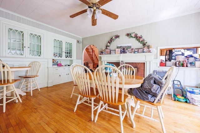 1-3 Fairoaks Ave, Methuen, MA 01844 - dining room with ornamental molding, light wood-style flooring, ceiling fan, and a fireplace