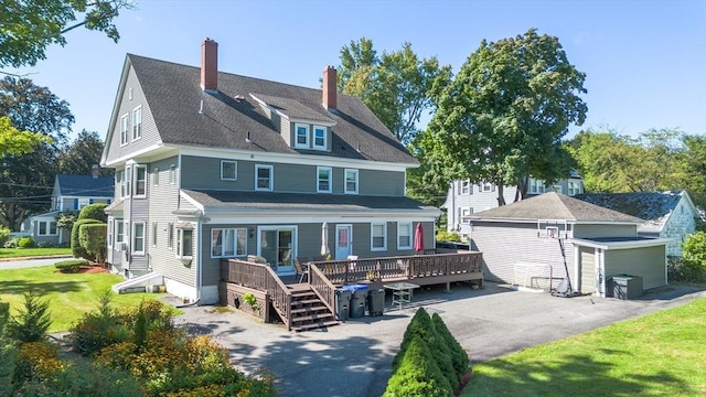 1-3 Fairoaks Ave, Methuen, MA 01844 - back of house featuring a deck, a yard, and a chimney