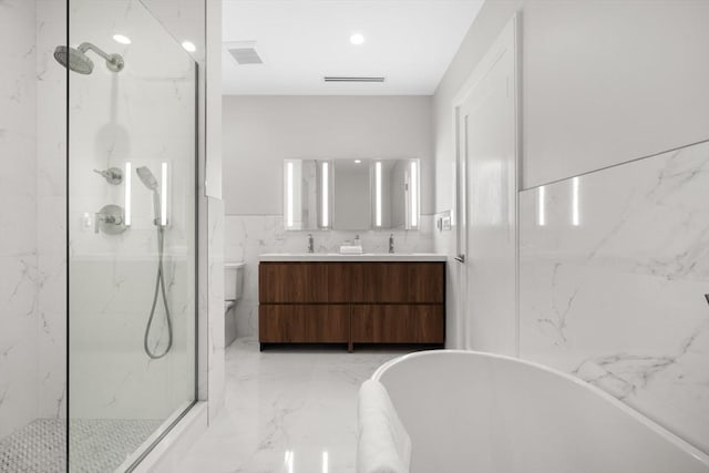 bathroom featuring double vanity, a marble finish shower, a soaking tub, marble finish floor, and a sink