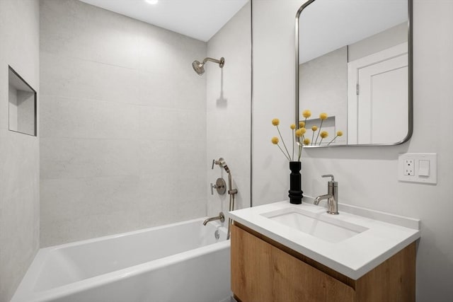 full bathroom featuring washtub / shower combination and vanity