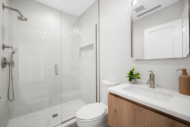 bathroom featuring visible vents, vanity, a shower stall, and toilet