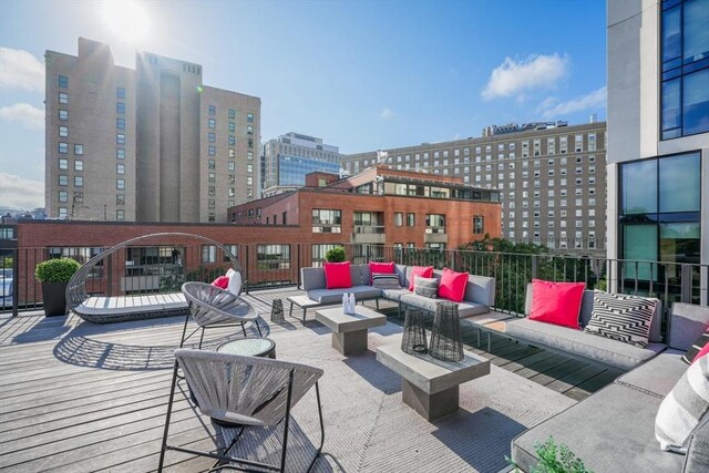 view of patio / terrace featuring an outdoor living space and a city view