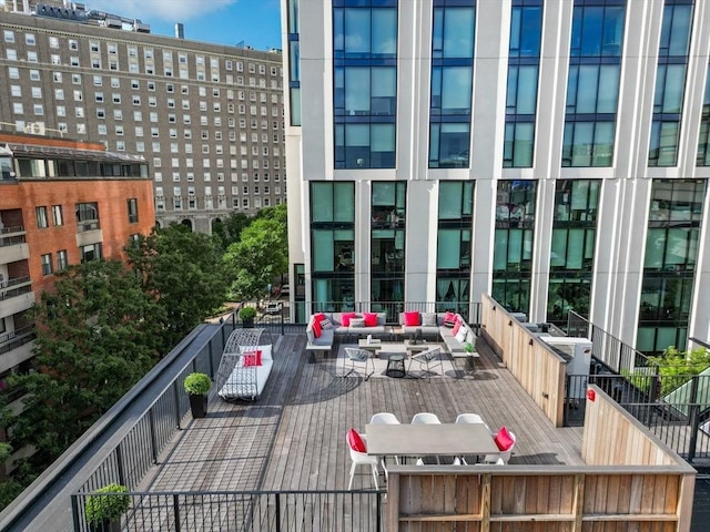 wooden terrace with outdoor lounge area