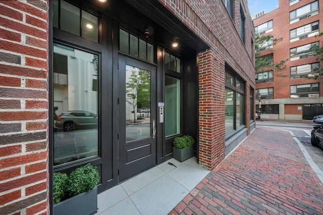 property entrance with brick siding