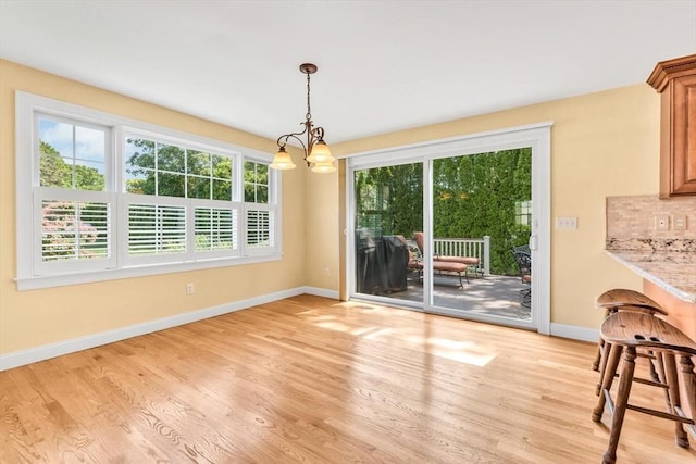 80 Schooner Ln, Barnstable, MA 02601 - dining area with a chandelier, baseboards, and light wood finished floors