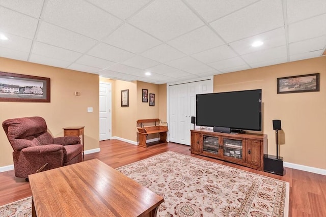 80 Schooner Ln, Barnstable, MA 02601 - living room with wood finished floors, a paneled ceiling, baseboards, and recessed lighting