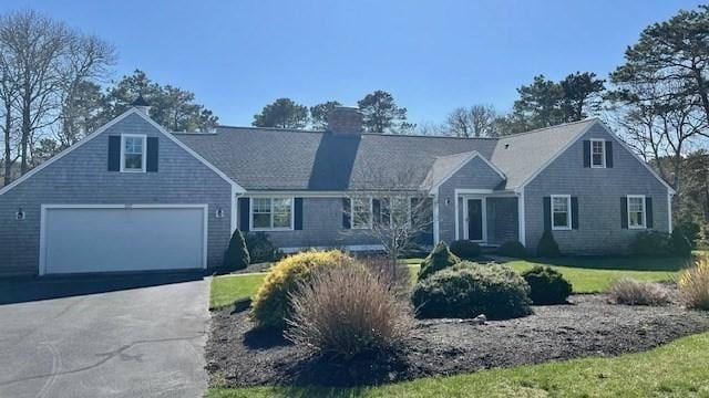307 Riverview Dr, Chatham, MA 02633 - ranch-style house featuring driveway, a chimney, a front yard, and a garage
