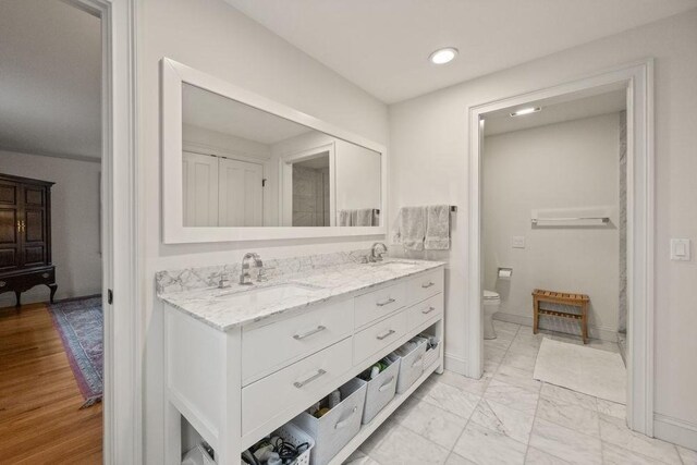 307 Riverview Dr, Chatham, MA 02633 - bathroom featuring recessed lighting, double vanity, toilet, and a sink