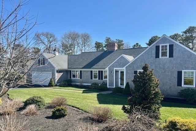 307 Riverview Dr, Chatham, MA 02633 - view of front of home featuring a chimney and a front yard