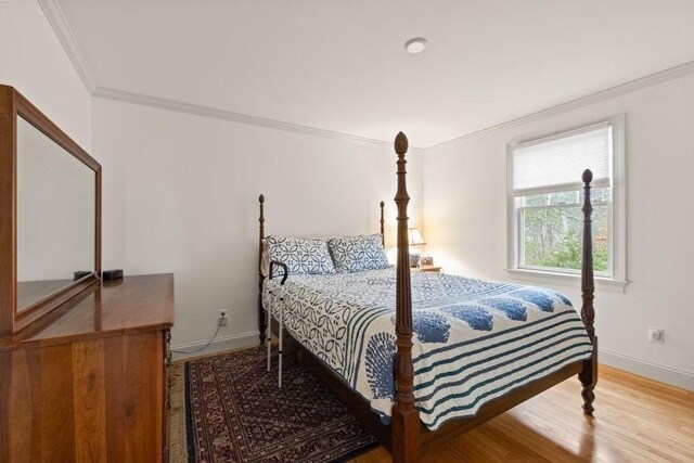 307 Riverview Dr, Chatham, MA 02633 - bedroom featuring wood finished floors, baseboards, and ornamental molding