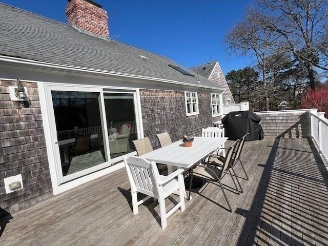 307 Riverview Dr, Chatham, MA 02633 - wooden terrace with area for grilling and outdoor dining area