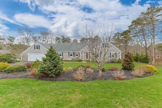 307 Riverview Dr, Chatham, MA 02633 - view of front of house with a chimney and a front lawn