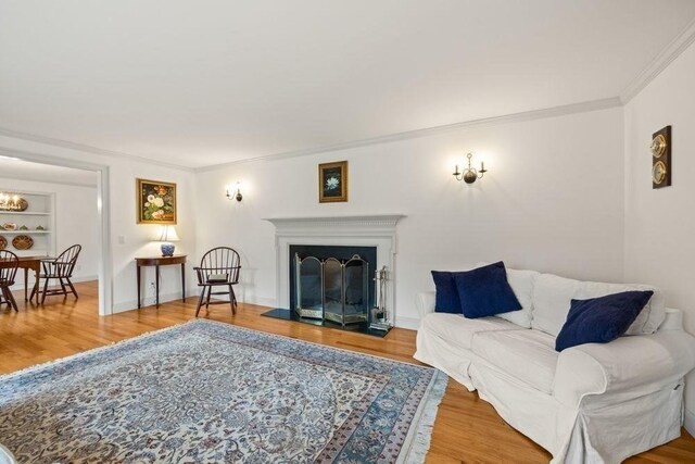 307 Riverview Dr, Chatham, MA 02633 - living area featuring ornamental molding and wood finished floors