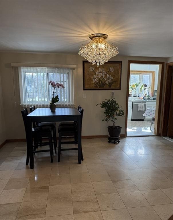 127 Sumner St, Milton, MA 02186 - dining area with baseboards, a chandelier, and light tile patterned floors