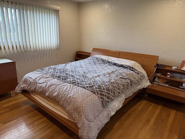 127 Sumner St, Milton, MA 02186 - bedroom featuring a textured wall and wood finished floors