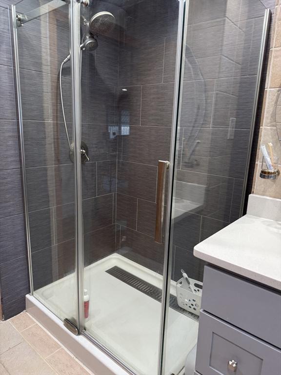 127 Sumner St, Milton, MA 02186 - bathroom featuring vanity and a shower stall