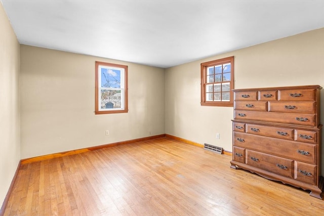 empty room with light wood-type flooring