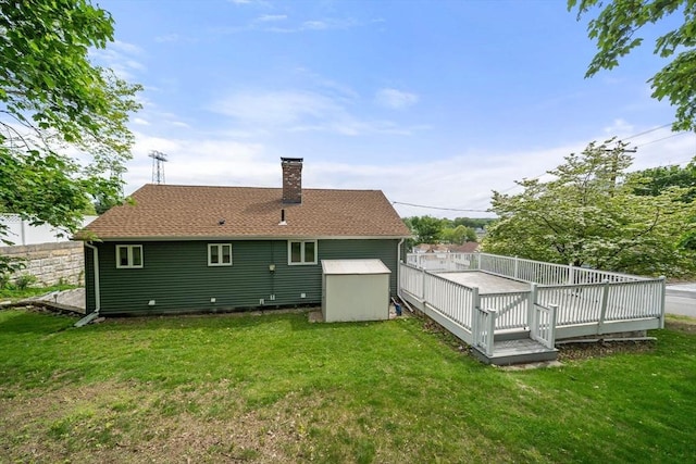 152 Audubon Ave, Braintree, MA 02184 - back of property with a chimney, a yard, and a deck