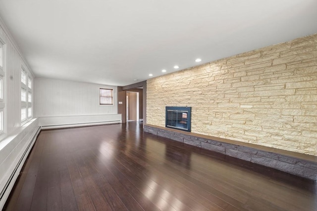152 Audubon Ave, Braintree, MA 02184 - unfurnished living room with a baseboard heating unit, a fireplace, hardwood / wood-style floors, and recessed lighting
