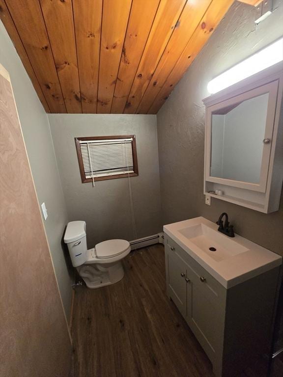 bathroom with toilet, wood ceiling, wood-type flooring, vanity, and a baseboard heating unit