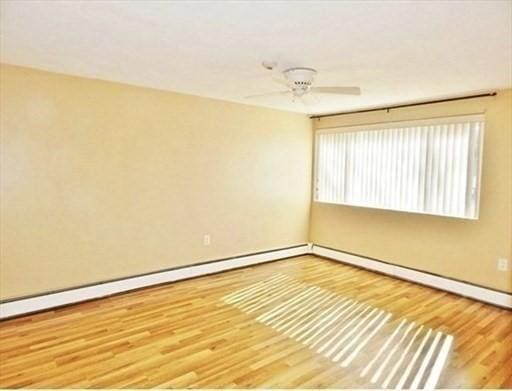 unfurnished room featuring ceiling fan and wood finished floors