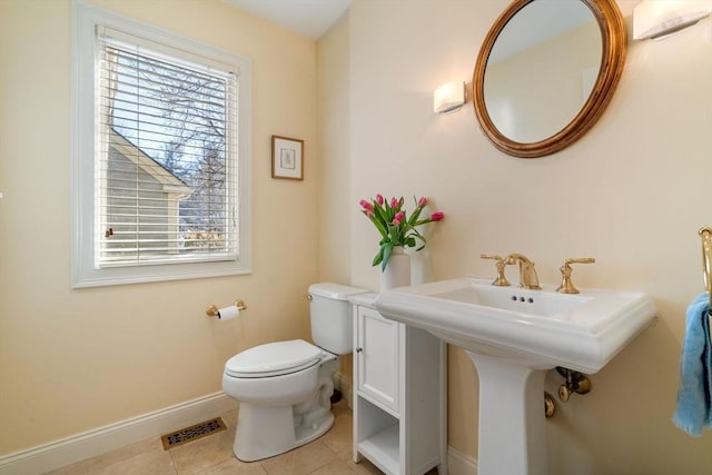 bathroom with tile patterned floors and toilet