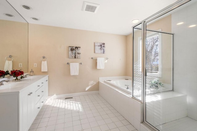 bathroom with vanity and independent shower and bath