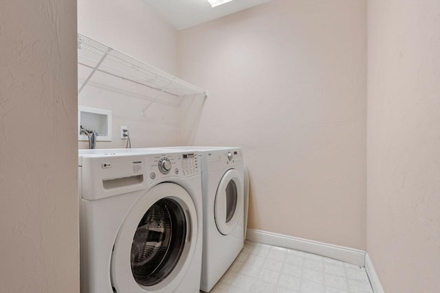 washroom with washing machine and dryer