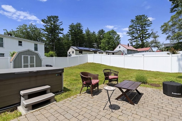 2 Wedgewood Rd, Dover, NH 03820 - fenced backyard with a patio area, a shed, and a hot tub