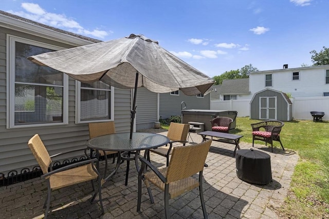 2 Wedgewood Rd, Dover, NH 03820 - view of patio / terrace with a hot tub, a shed, outdoor dining area, and an outdoor fire pit