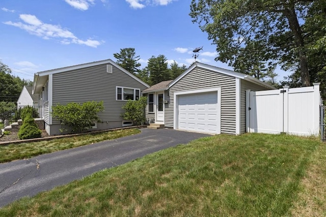 2 Wedgewood Rd, Dover, NH 03820 - ranch-style house featuring an outbuilding, asphalt driveway, and a garage