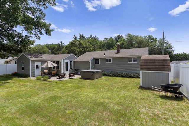 2 Wedgewood Rd, Dover, NH 03820 - back of property featuring a patio area, a hot tub, and a shed